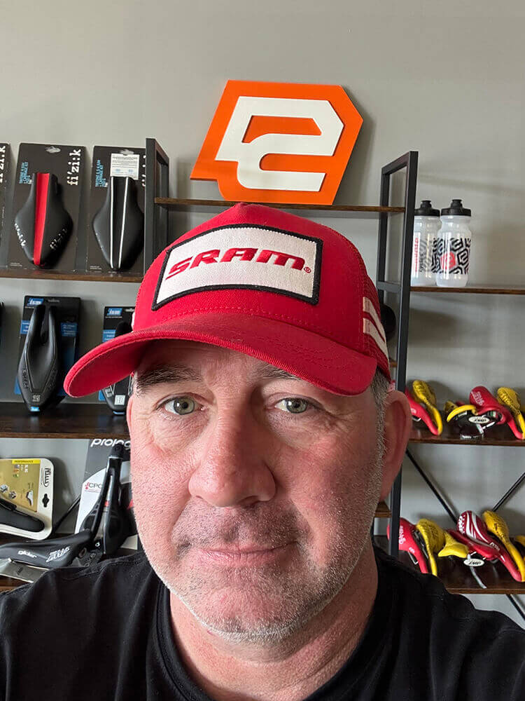 A man sitting in a bike shop